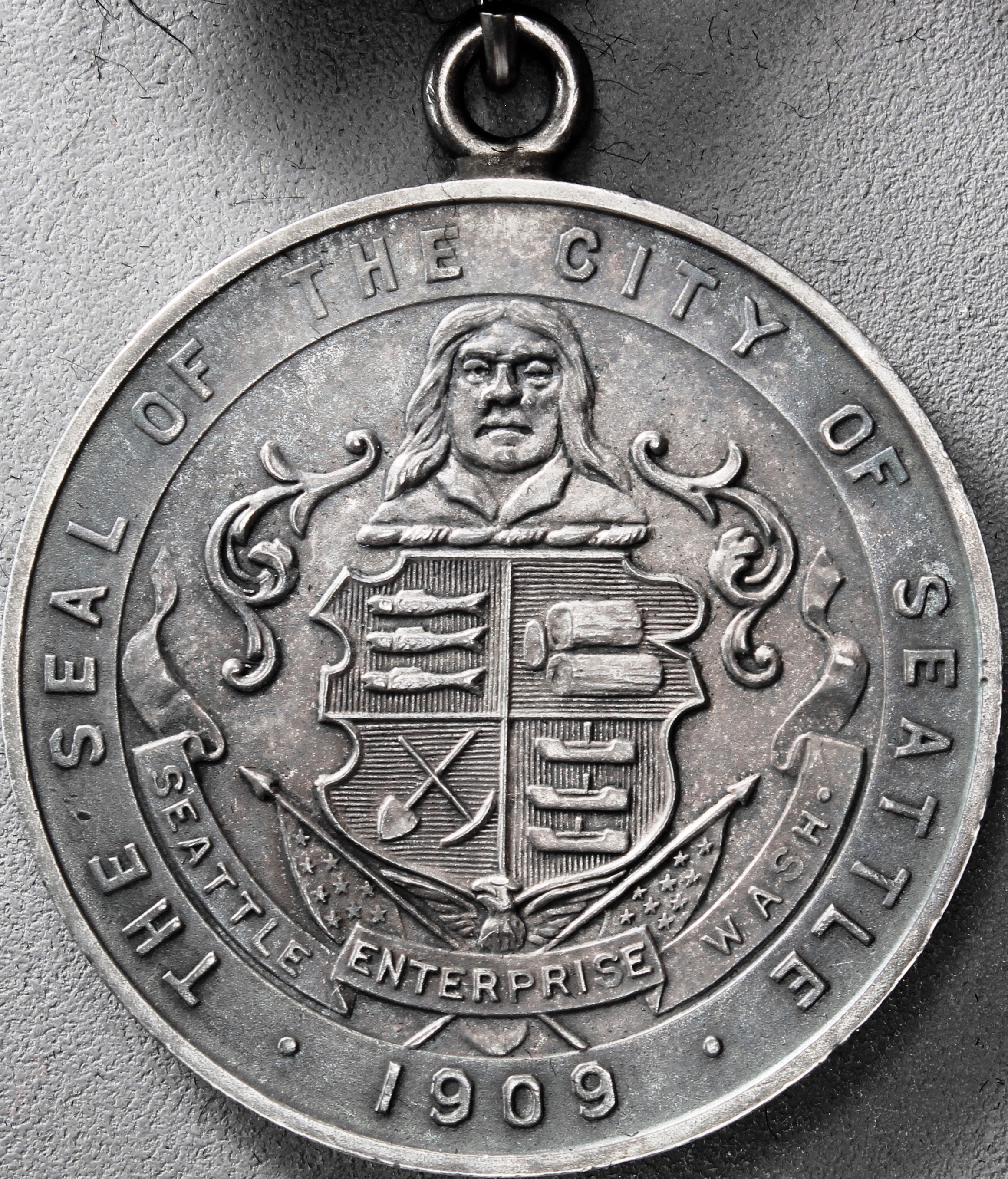 HK-353 1909 Alaska-Yukon-Pacific Exposition Official SCD – Silver with “S” on edge