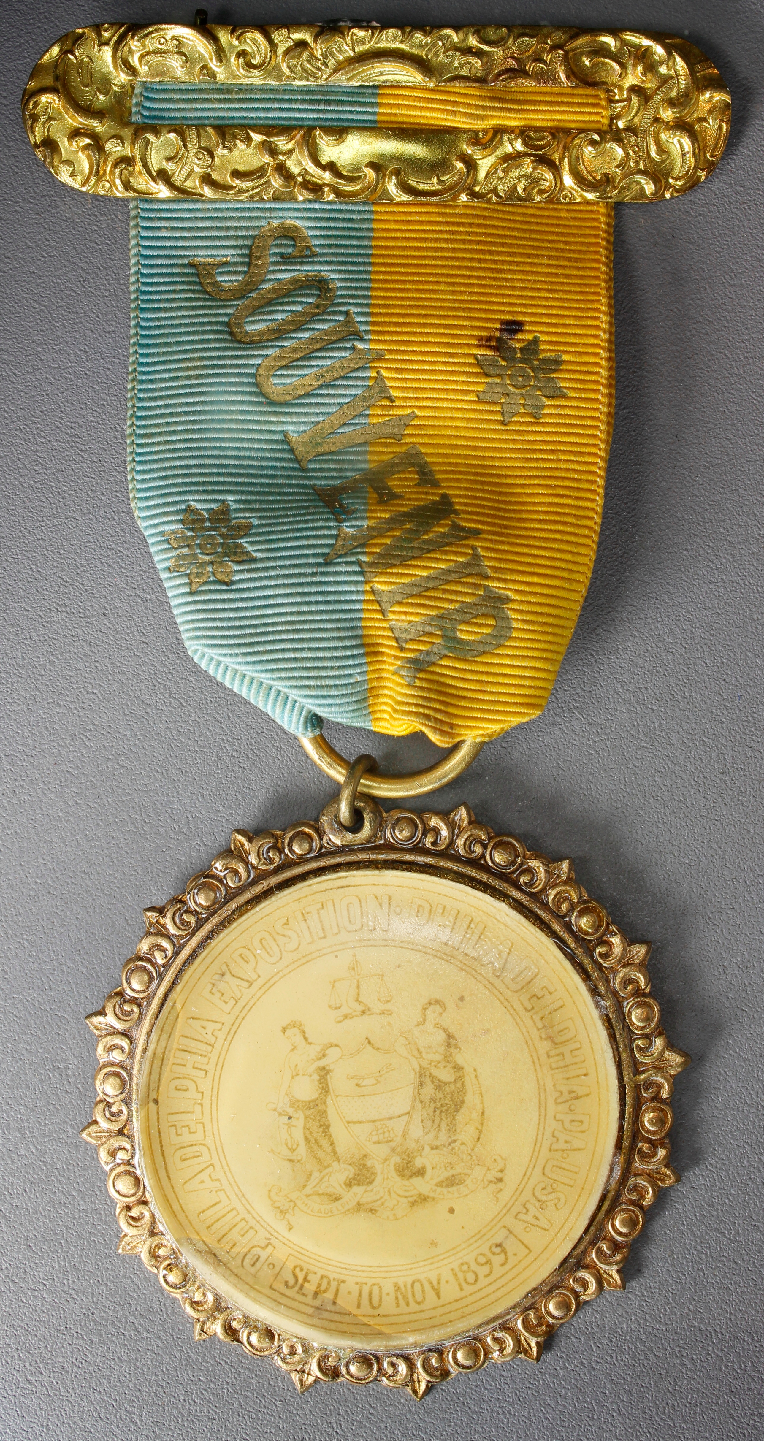HK-644 1899 National Export Exposition City Seal badge